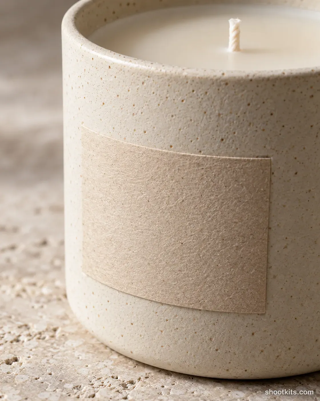 Label detail: candle photo made with ChatGPT. Stone surface.
